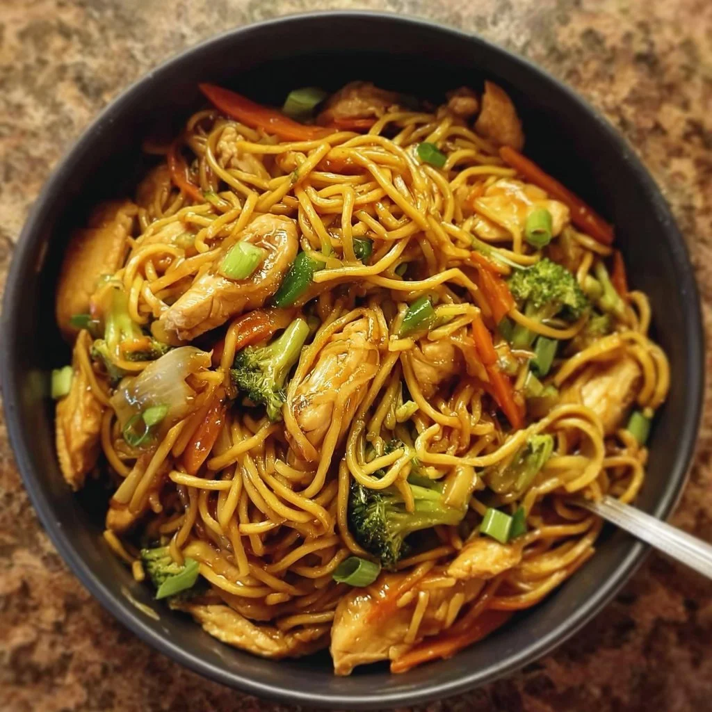 Delicious Gluten-Free Chicken Lo Mein served in a bowl with vegetables.