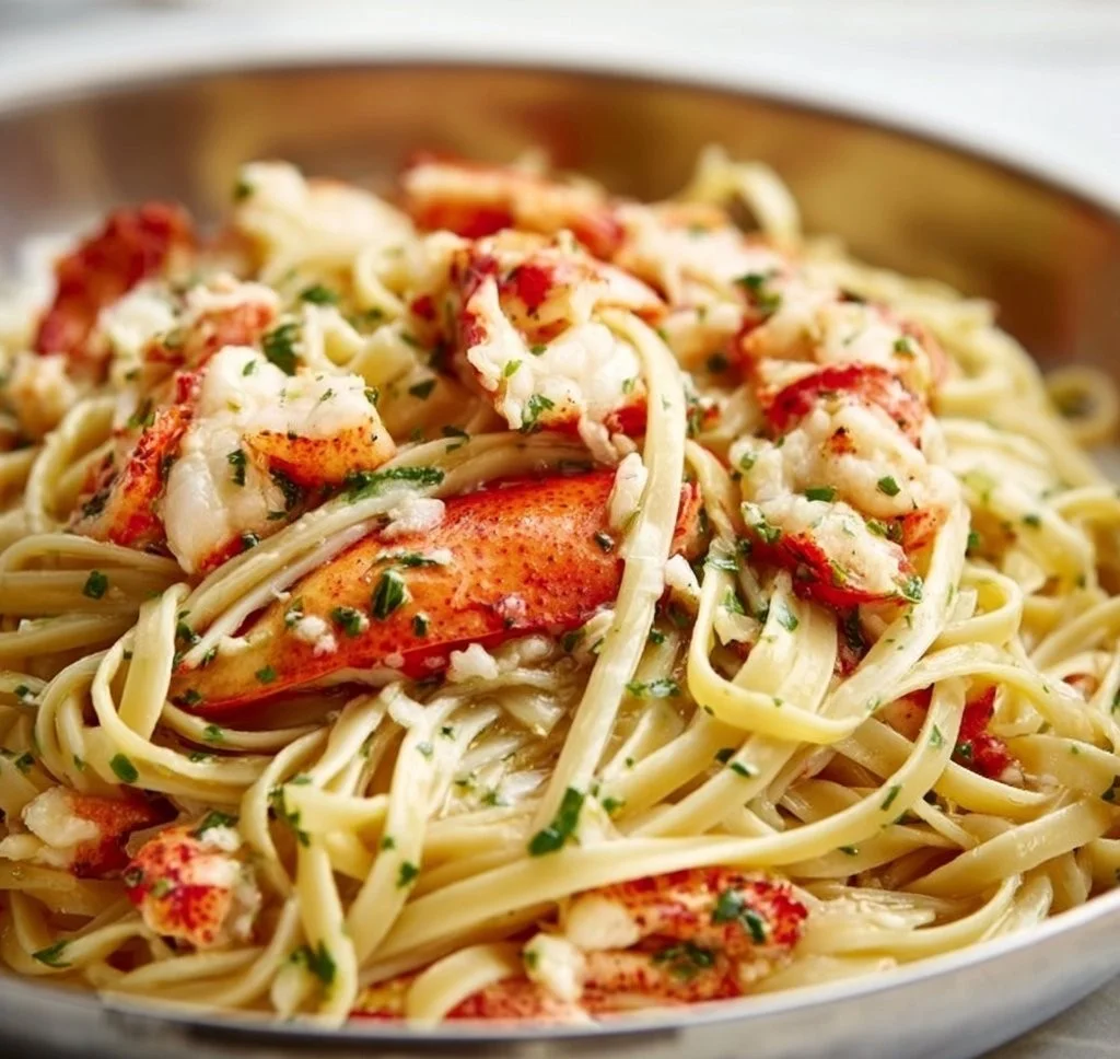 Delicious Lobster Scampi with Linguine garnished with herbs